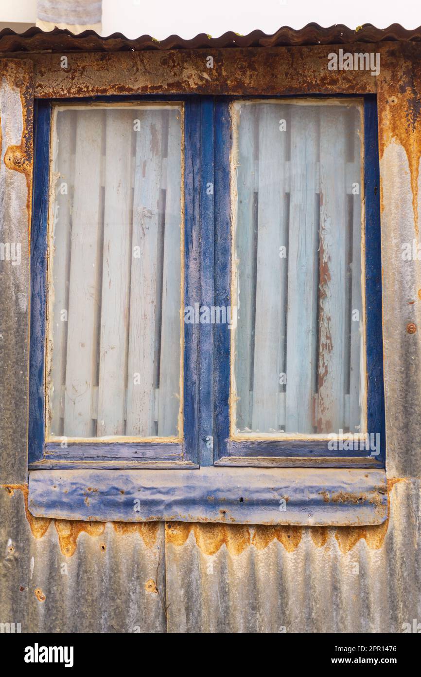 Blocked window of an old abandoned building close up Stock Photo - Alamy