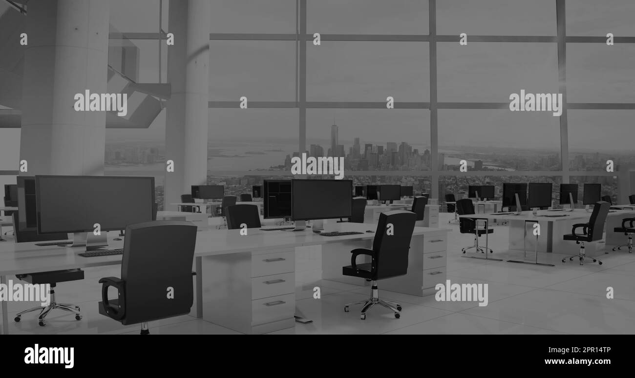 Image of empty office with computers over cityscape Stock Photo
