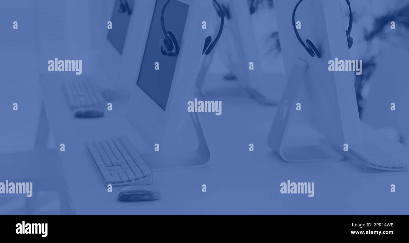 Composition of computers on desk in office Stock Photo