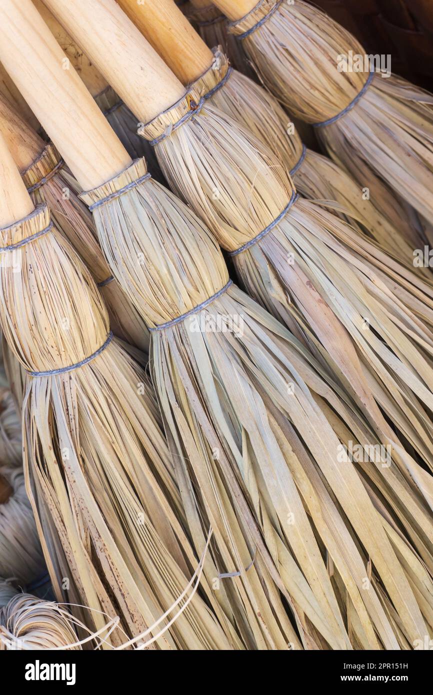 Small ecofriendly handmade brooms close up background Stock Photo Alamy