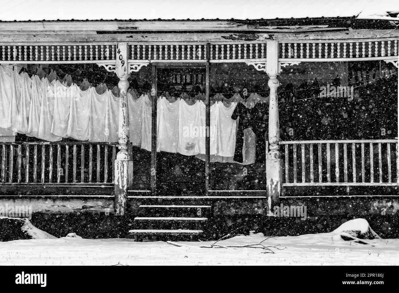 Amish laundry drying during a cold and snowy day on a porch in Central Michigan, USA [No property release; editorial licensing only] Stock Photo