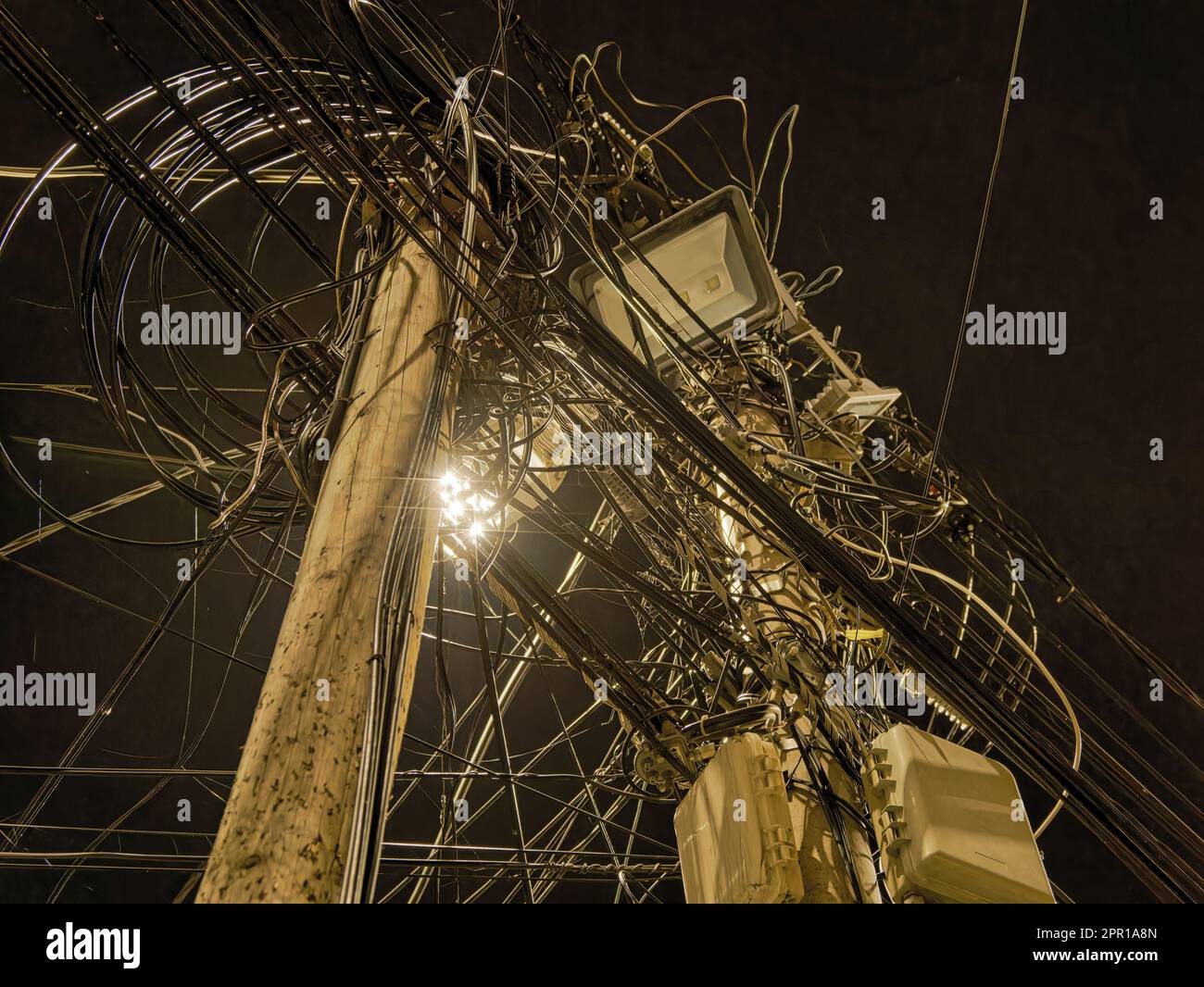 Electric pole wires in Prizren city by night Stock Photo - Alamy