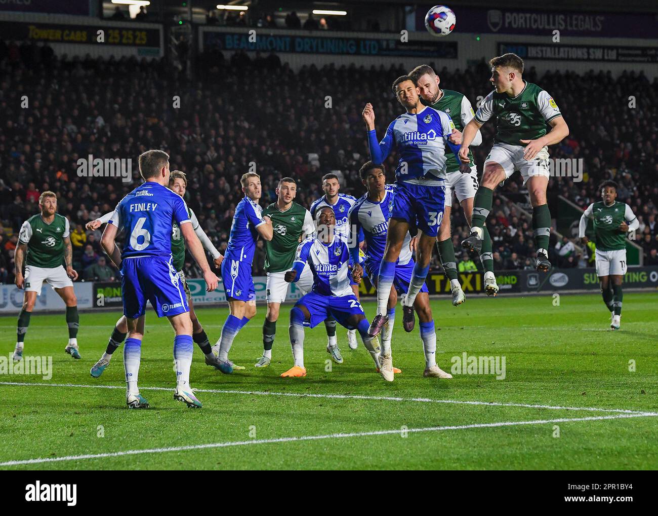 Plymouth, UK. 25th Apr, 2023. Luca Hoole #30 of Bristol Rovers battles in the air with Macaulay Gillesphey #3 of Plymouth Argyle during the Sky Bet League 1 match Plymouth Argyle vs Bristol Rovers at Home Park, Plymouth, United Kingdom, 25th April 2023 (Photo by Stan Kasala/News Images) in Plymouth, United Kingdom on 4/25/2023. (Photo by Stan Kasala/News Images/Sipa USA) Credit: Sipa USA/Alamy Live News Stock Photo