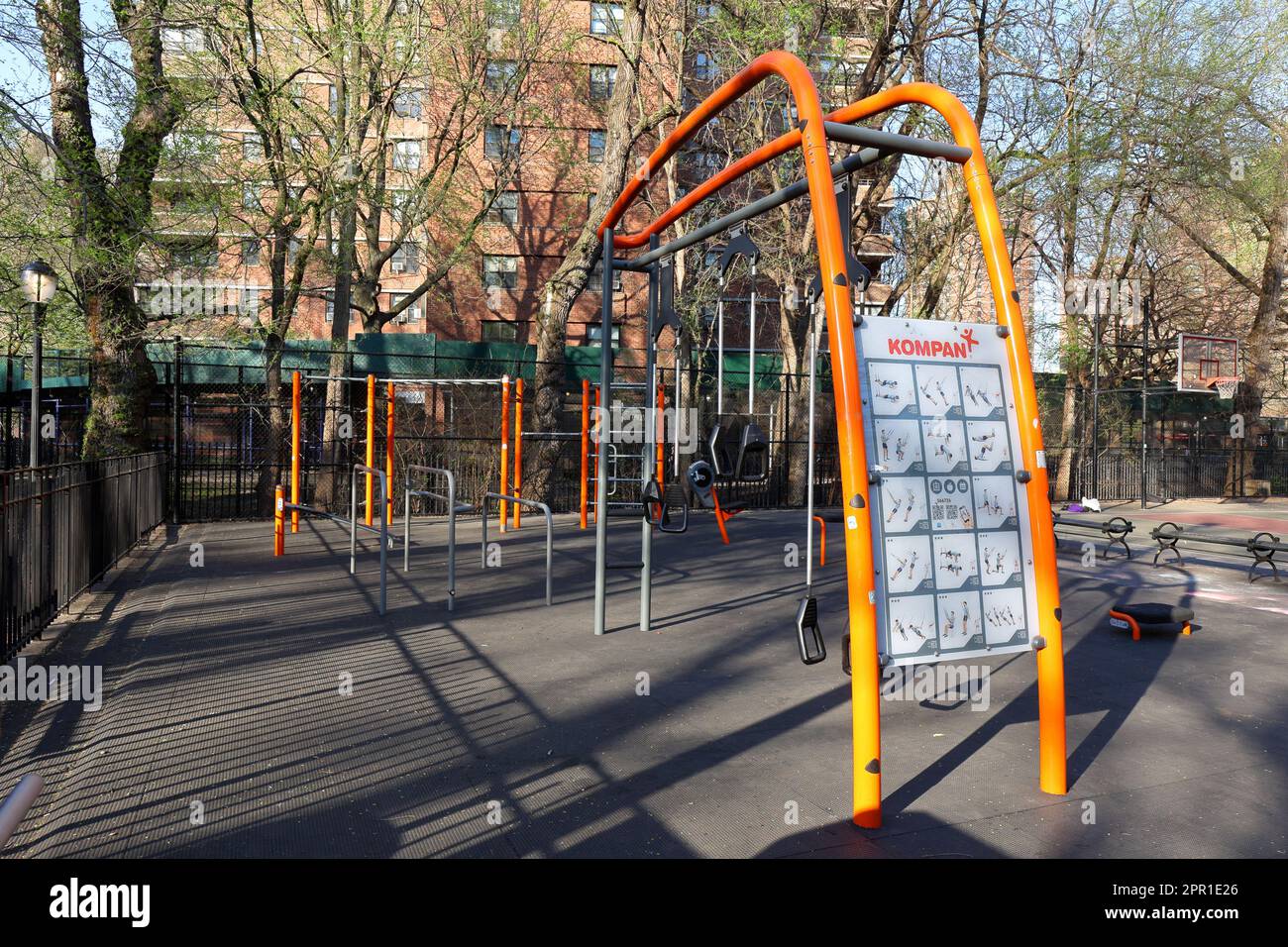 Kompan outdoor exercise and gym equipment for fitness training, and street workout at Seward Park in Manhattan's Lower East Side, New York City. Stock Photo