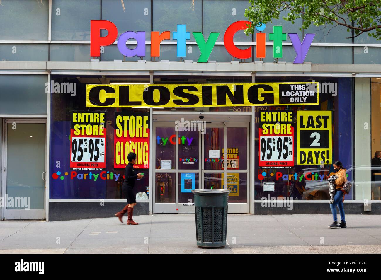 A Party City in Midtown Manhattan with store closing and liquidation sales signs in the window, New York, April 24, 2023. Stock Photo