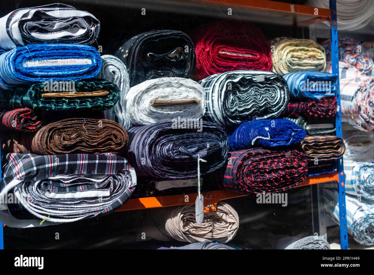 Material stacked in shop shot from outside looking in Stock Photo Alamy
