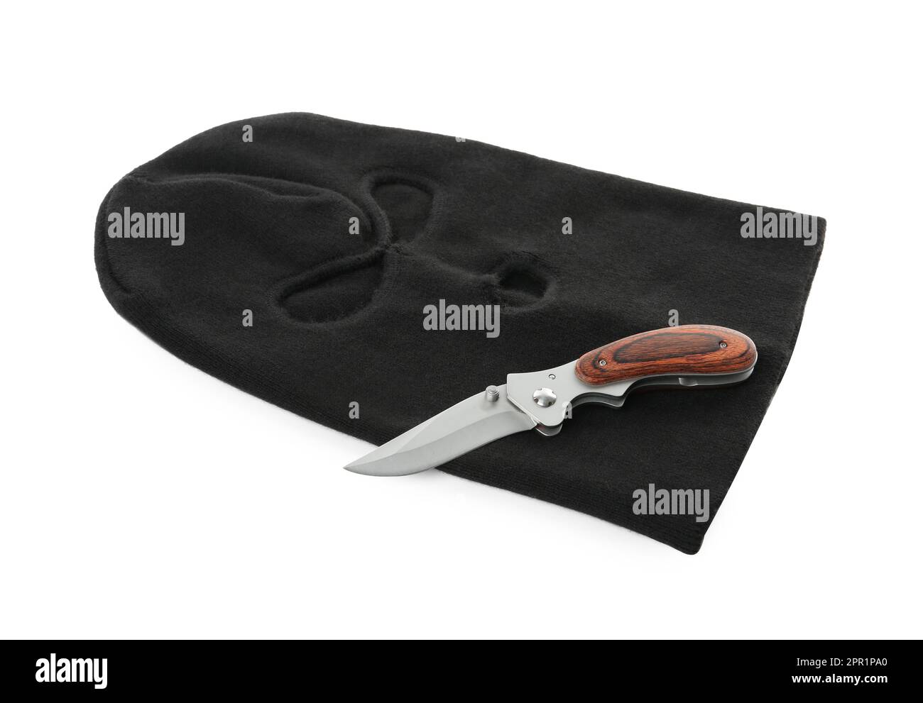 Black knitted balaclava and knife on white background Stock Photo Alamy