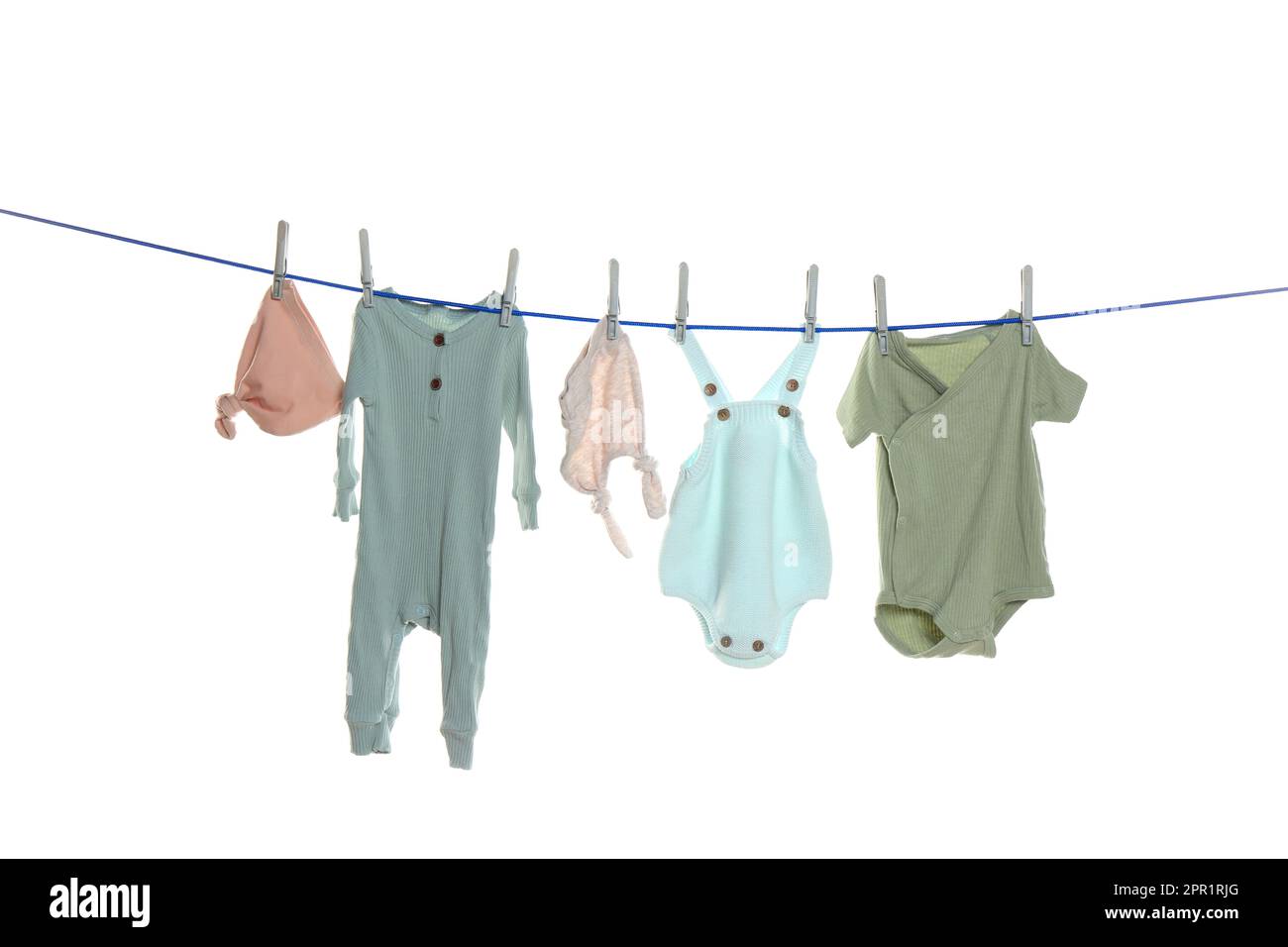Colorful baby clothes drying on laundry line against white background
