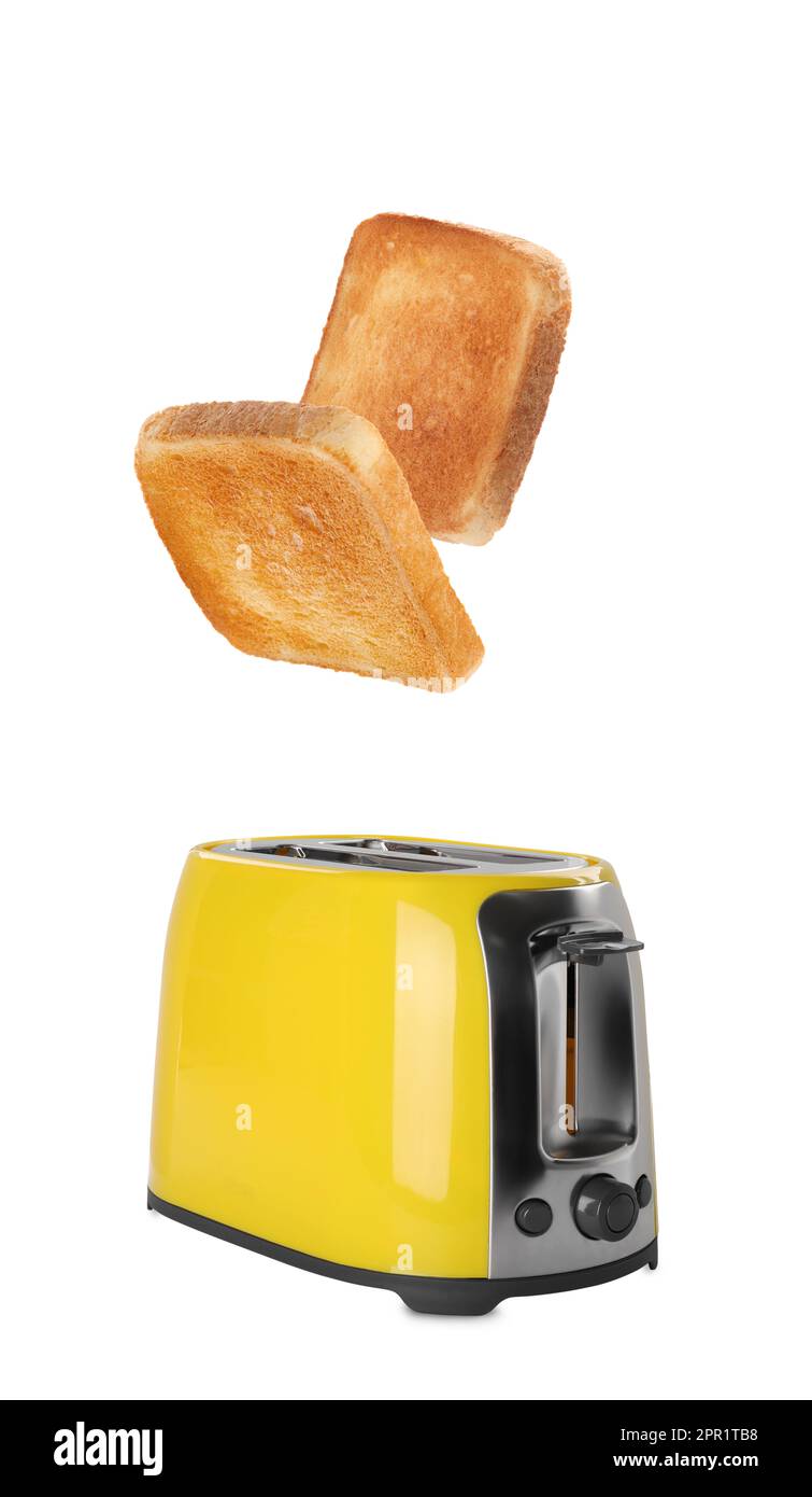 Roasted bread popping up of toaster on white background Stock Photo Alamy