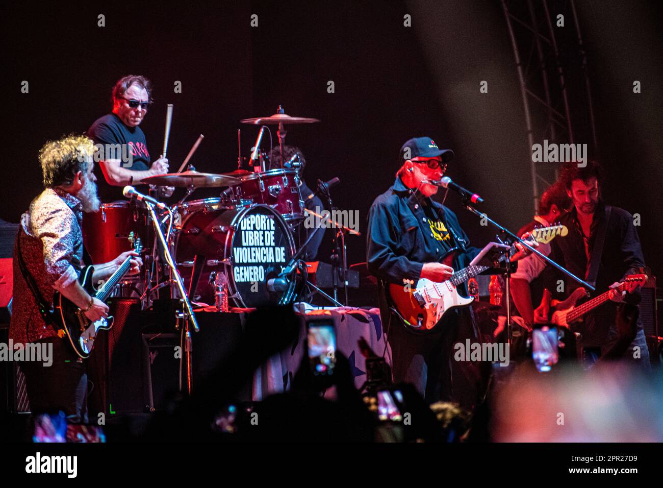 Caballeros de la Quema rock band and León Gieco during a live show at Luna Park Stadium, Buenos Aires, Argentina. Stock Photo