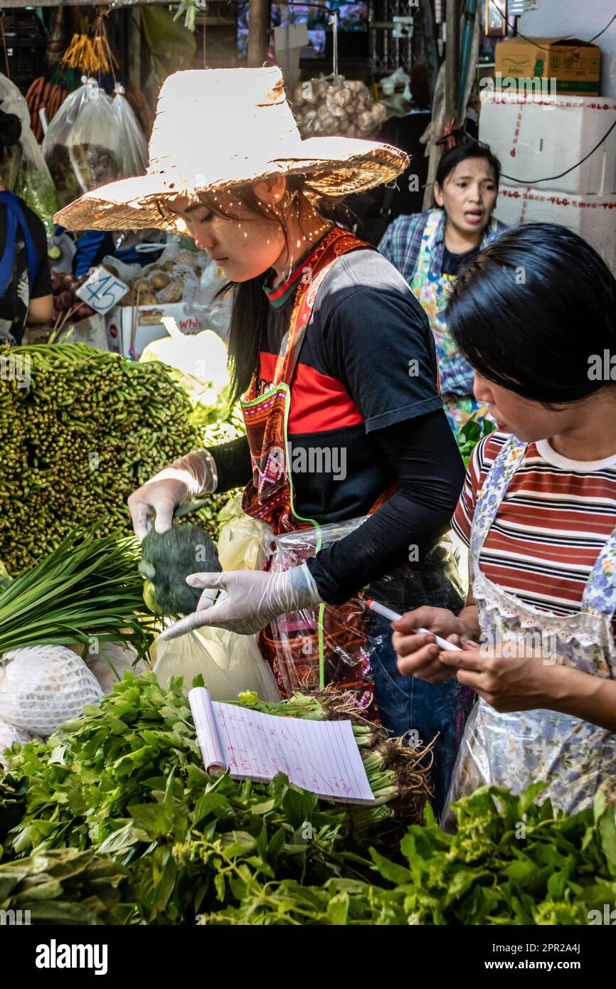 Women vegetable vendors on Khlong Toei market, Bangkok, Thailand Stock Photo