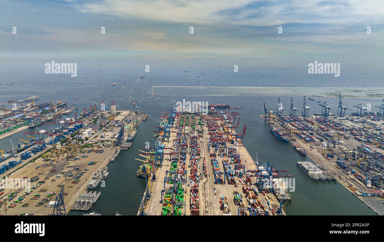 Aerial view of sea cargo port with containers and cranes. Tanjung Priok