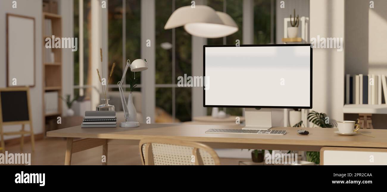 Modern home workspace with desktop computer with white screen mockup,  coffee cup, and decor on a table over blurred background of cozy living room.  3d Stock Photo - Alamy, image size:1300x647