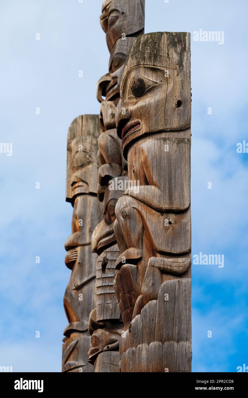 First Nations totem poles close up of Gitxsan natives in Gitanyow or Kitwancool, British Columbia, Canada. Stock Photo