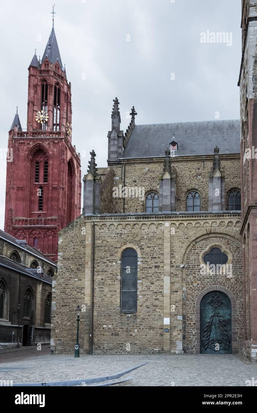 Iconic buildings in the city of Maastricht, Netherlands - the Gothic Church of Saint John (red tower) and the stunning Basilica of Saint Servatius Stock Photo
