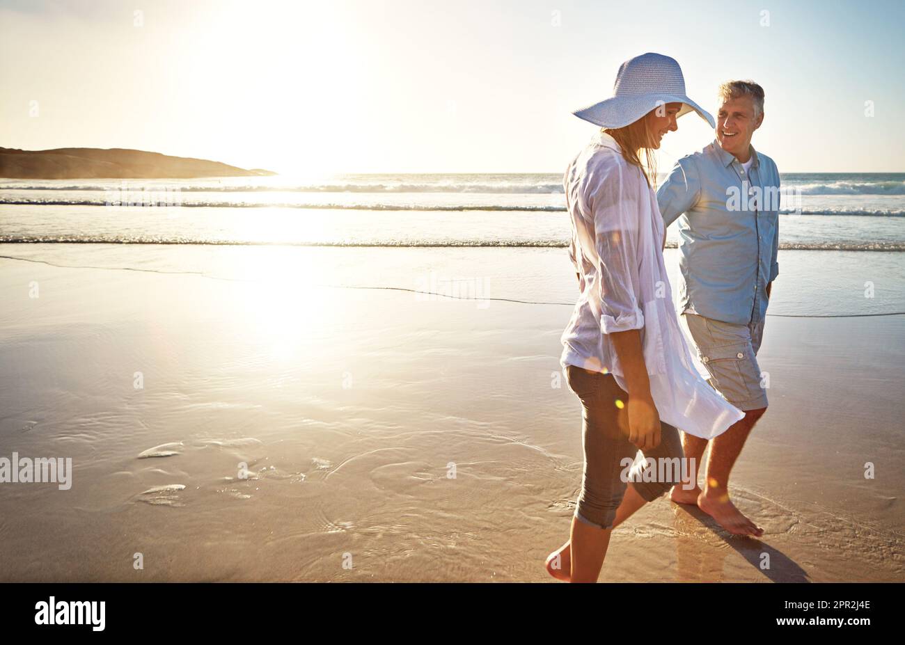 Nothing beats good conversation and a great view. a mature couple spending  the day at the beach Stock Photo - Alamy