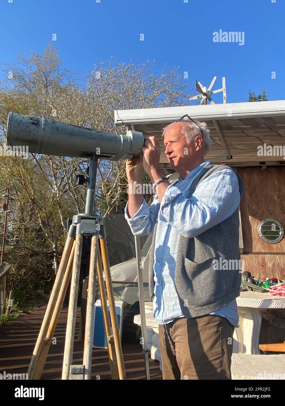 Dores, UK. 21st Apr, 2023. 'Nessie hunter' Steve Feltham looks through a telescope at Loch Ness. For decades, Steve Feltham has been observing the legendary lake in the Scottish Highlands. It is obvious who plays the leading role around Loch Ness: the legend of the lake monster has fired people's imagination for decades. But is Nessie really in the famous lake? (to dpa 'Really a monster? Loch Ness does not reveal its mystery') Credit: Benedikt von Imhoff/dpa/Alamy Live News Stock Photo