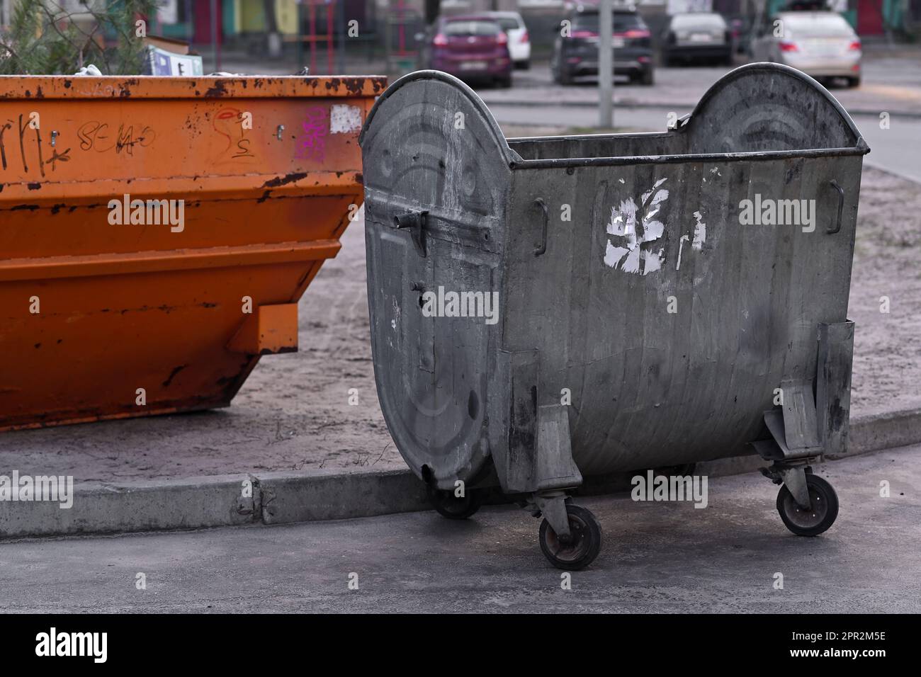 Two metal garbage cans. unsorted garbage. Outdoor. Stock Photo