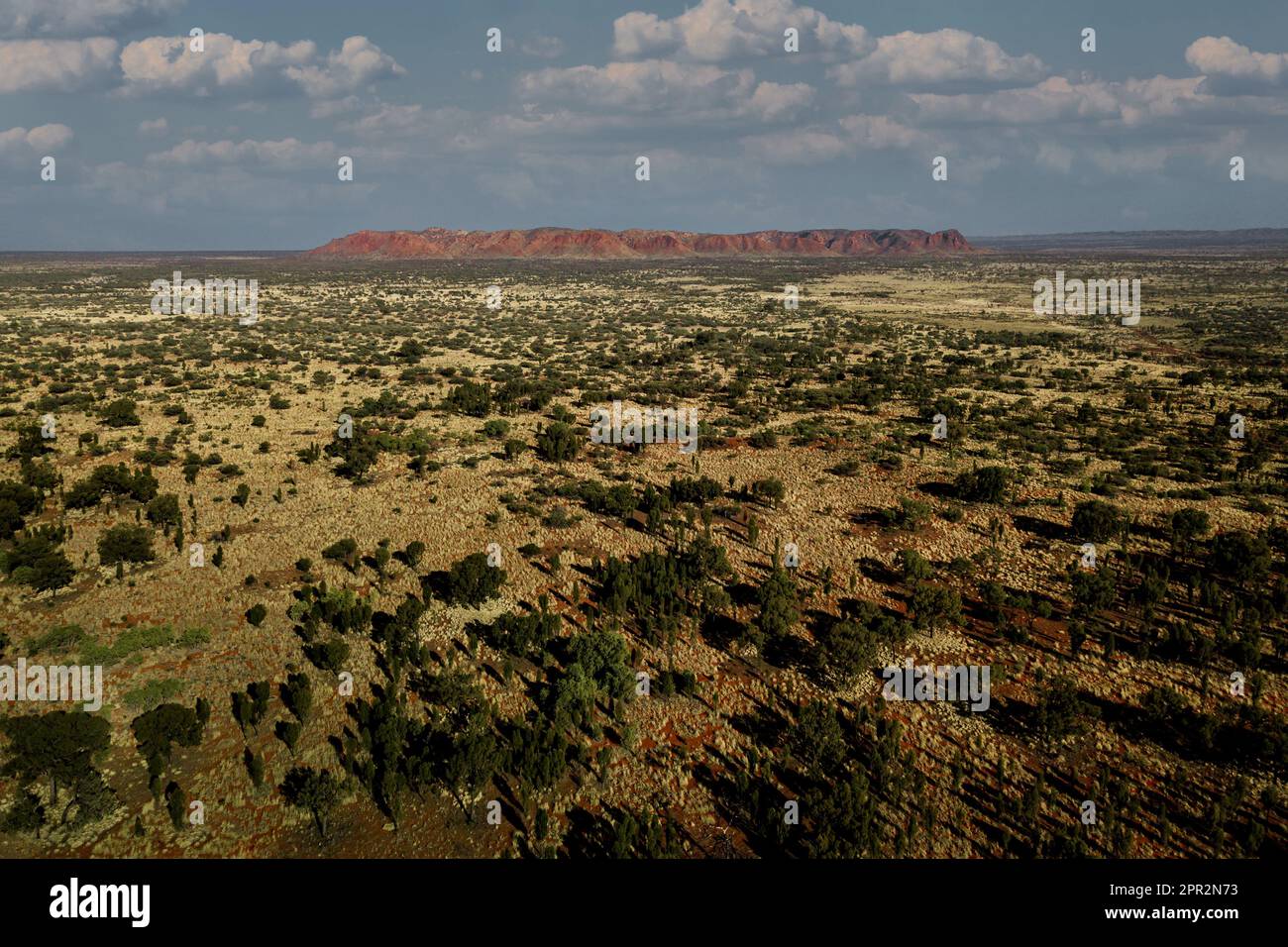 Aerial shot of Tnorala (Gosse Bluff) crater in the desert plains of Central Australia. Stock Photo