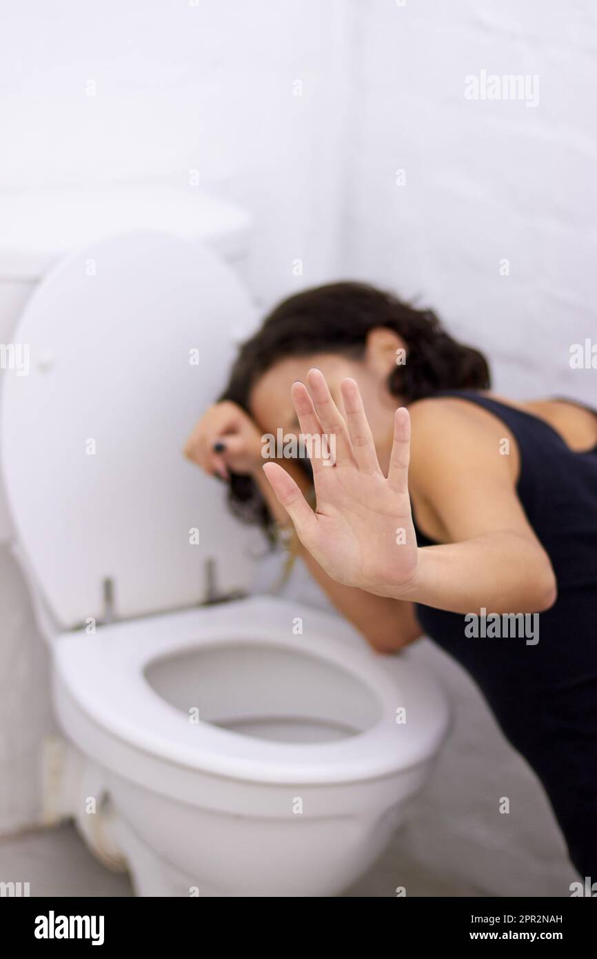 Bathroom, hand and sick woman on floor suffering from anorexia