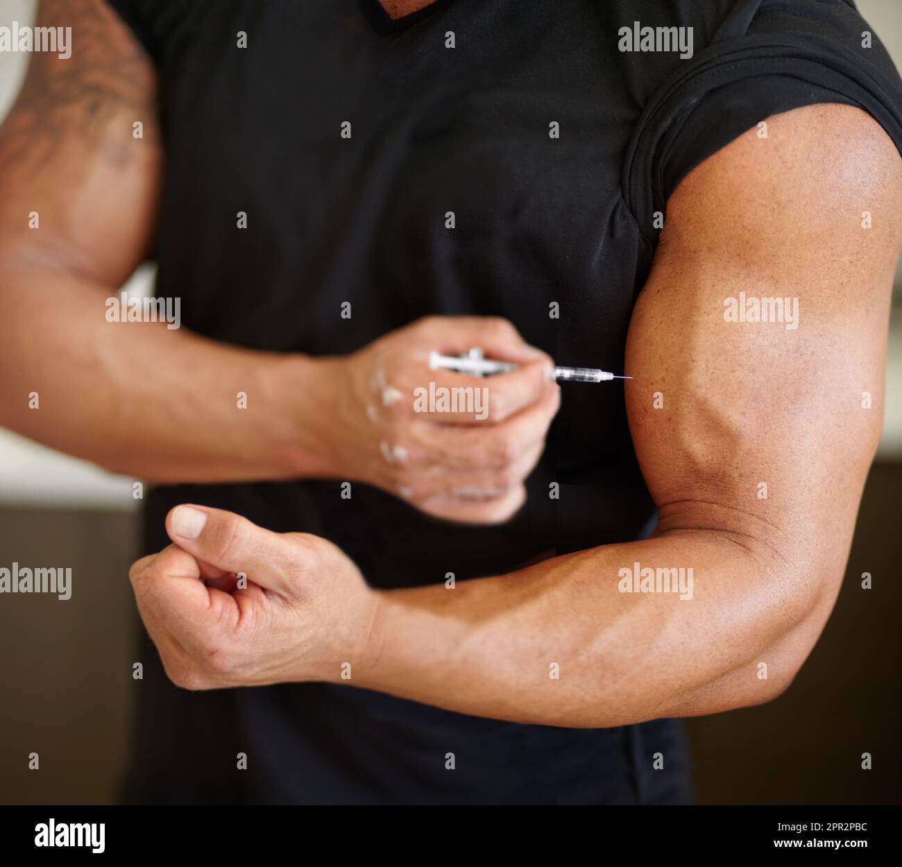 Arm, steroids and syringe with a bodybuilder man using a needle for a bicep muscle injection
