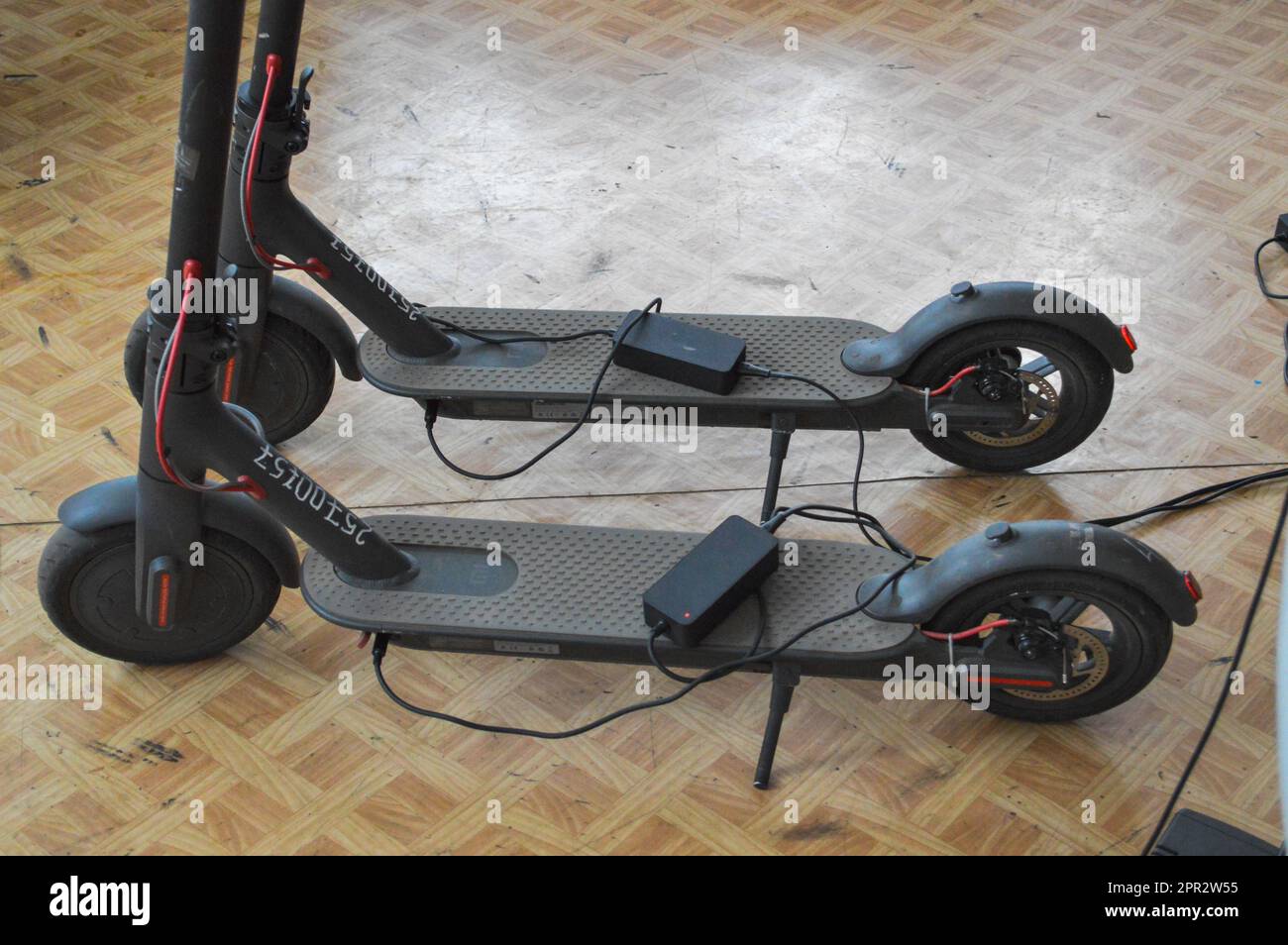 Two new black electronic two-wheeled fashionable modern fast electric scooters. Stock Photo