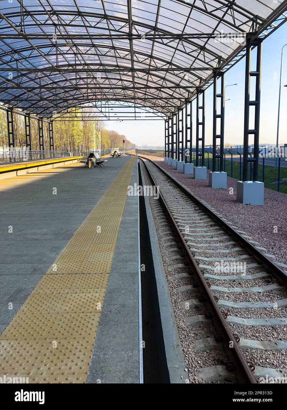 Modern railway station, train station with a transparent canopy for ...