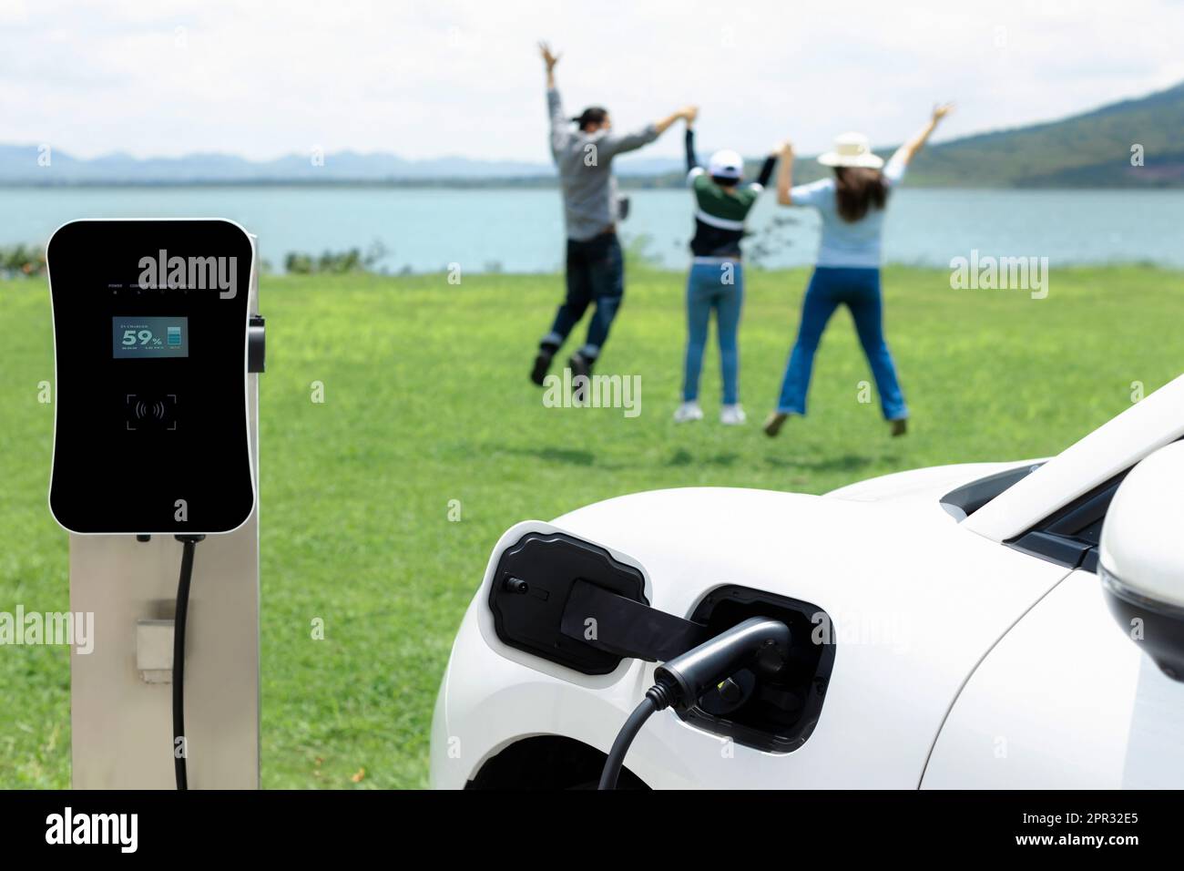 Concept of progressive happy family enjoying their time at green field