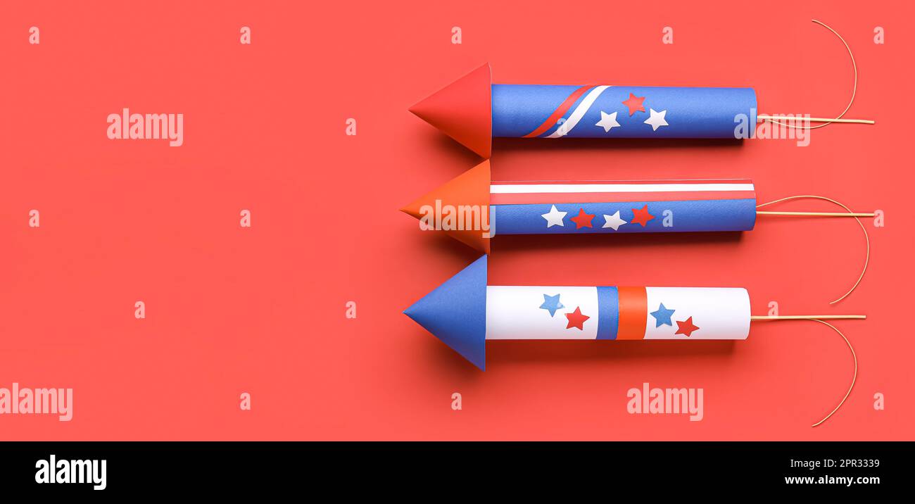 Firework rockets for USA Independence Day on red background with space ...