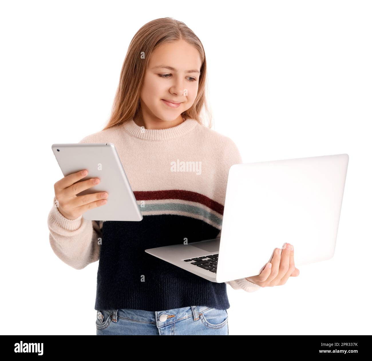 Little girl with laptop and tablet computer on white background Stock ...