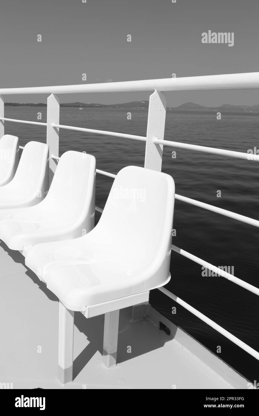 Some Chairs on the deck of a ferry in Greece Stock Photo