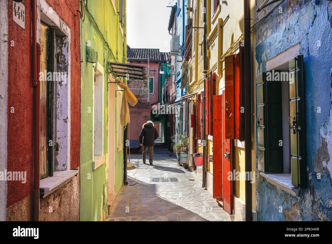 Quiet, narrow back street and colourful houses in Burano Island, Venice ...