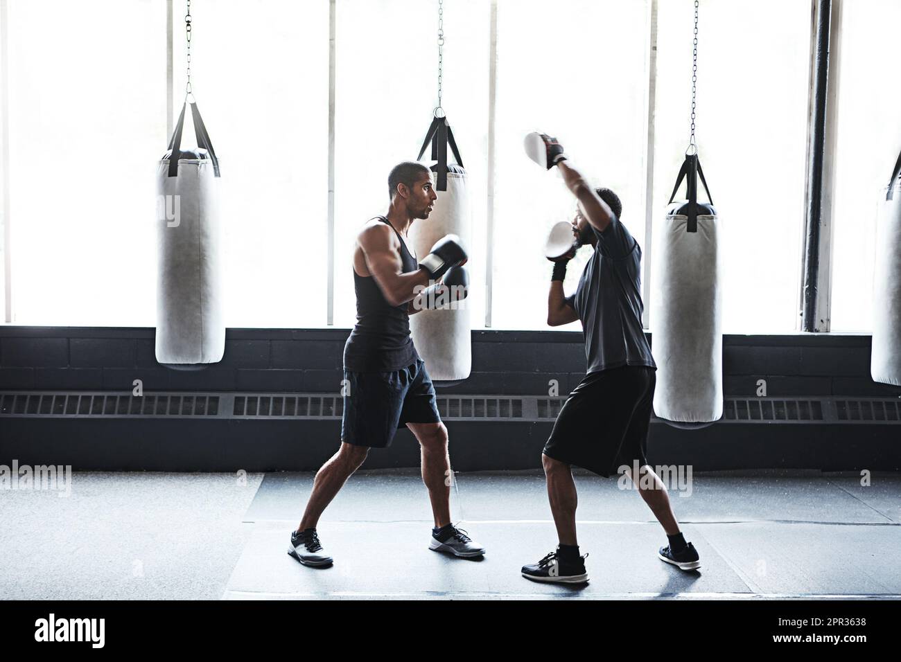Rhythm is everything in boxing. a male boxer practising his moves with ...