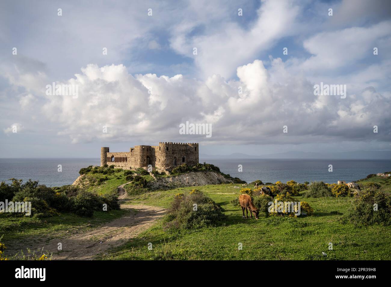 Small ruined castle on the shores of the Strait of Gibraltar at Cape Malabata. Stock Photo