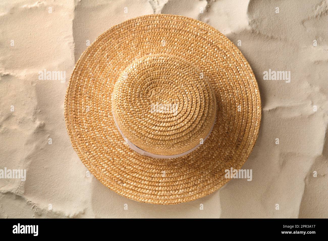 Straw wicker hat on the sand. Weave hats from the sun. Handmade. Close-up  Stock Photo - Alamy