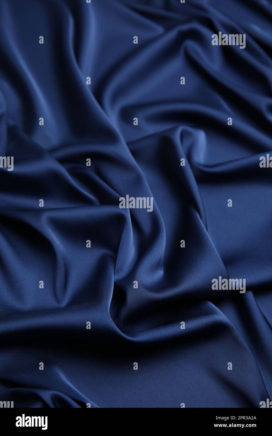 Crumpled dark blue silk fabric as background Stock Photo - Alamy
