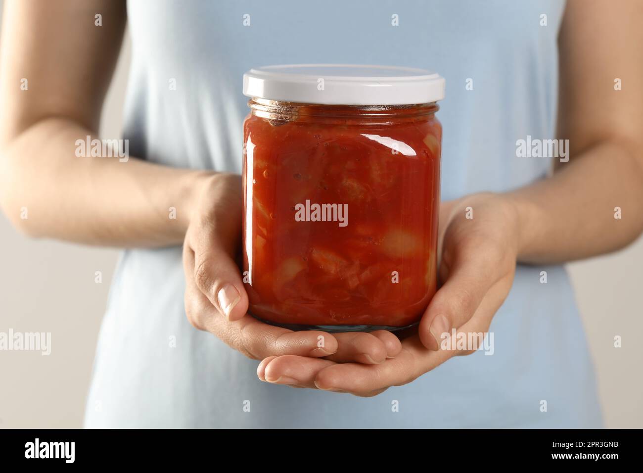 Woman holding jar of canned lecho, closeup Stock Photo - Alamy