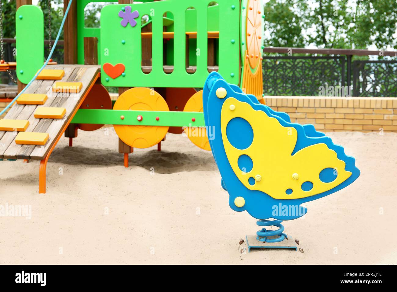 New butterfly shaped spring rider and colorful train playset on