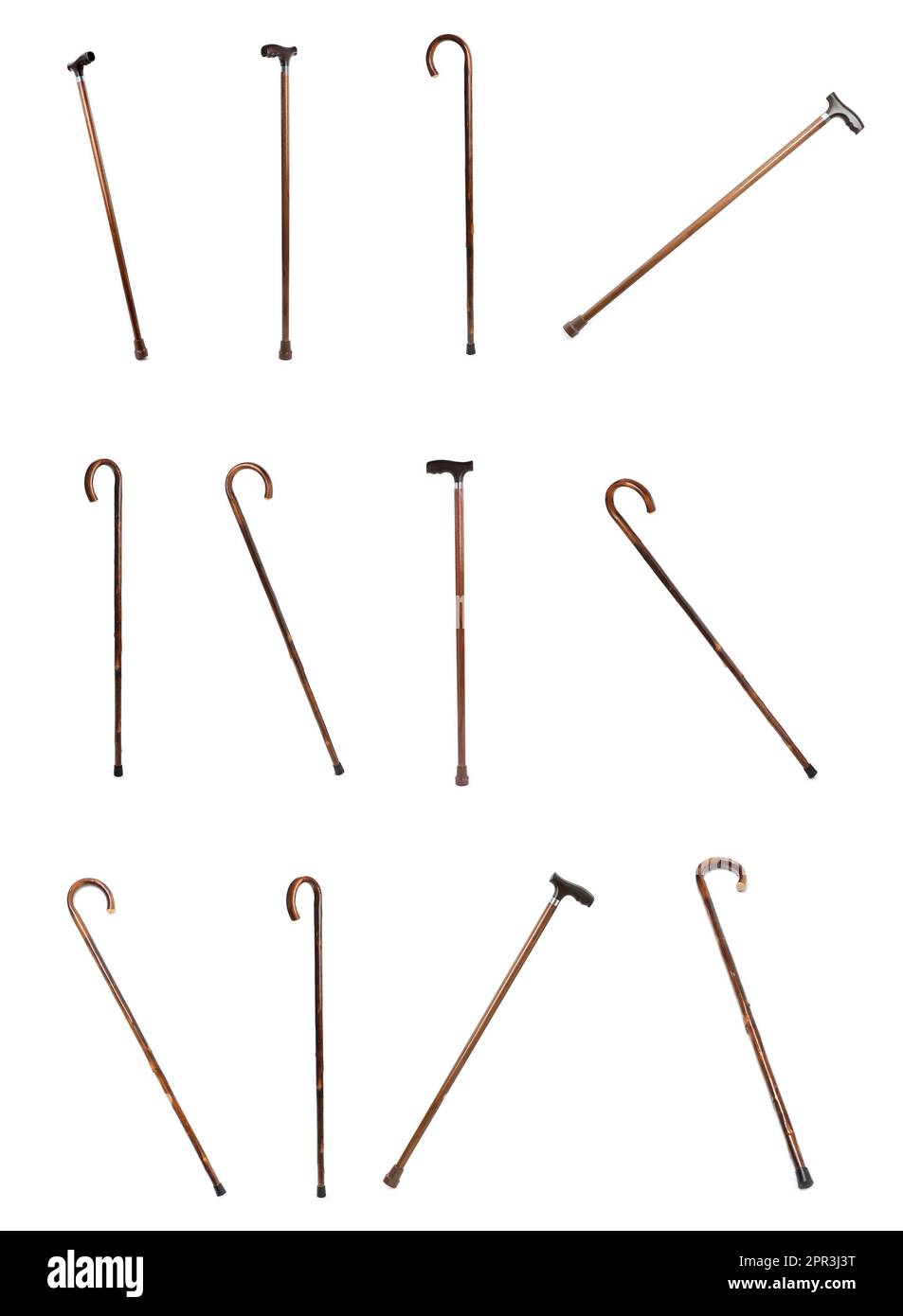 Set with elegant wooden walking canes on white background Stock Photo