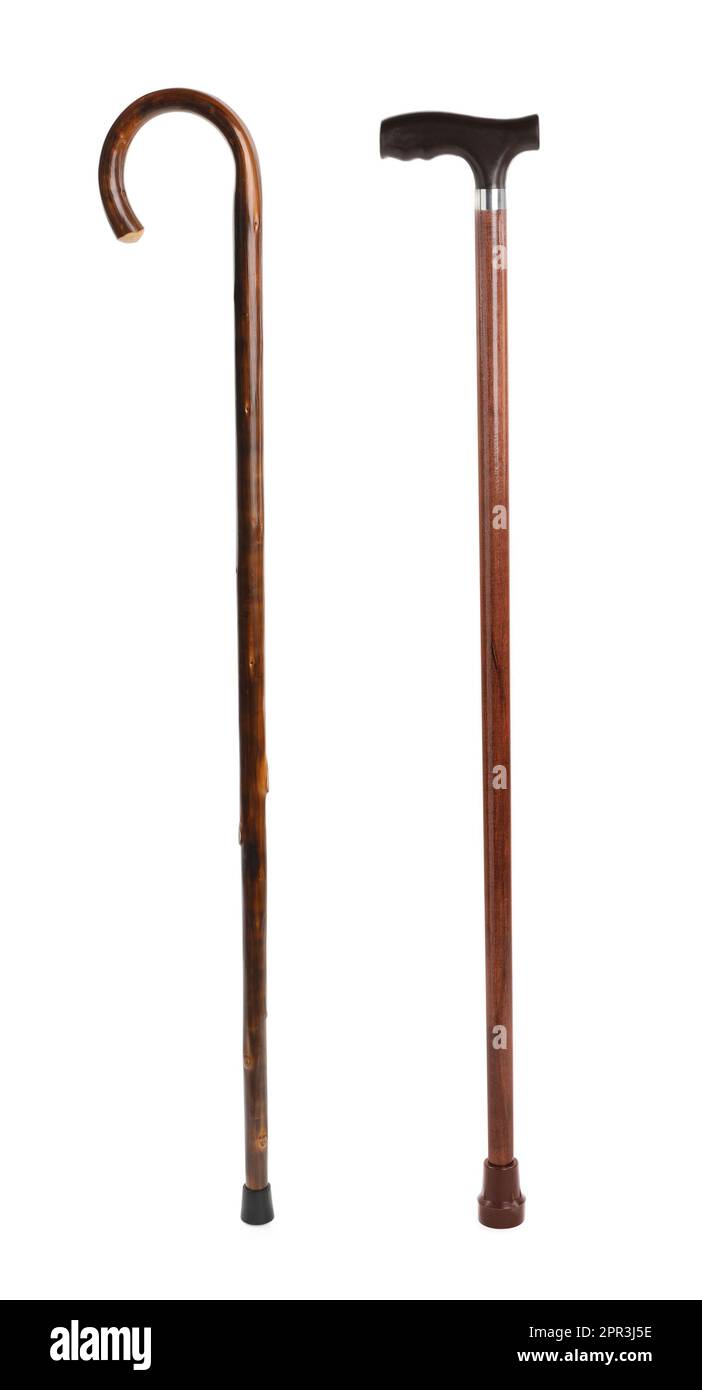 Elegant wooden walking canes on white background Stock Photo