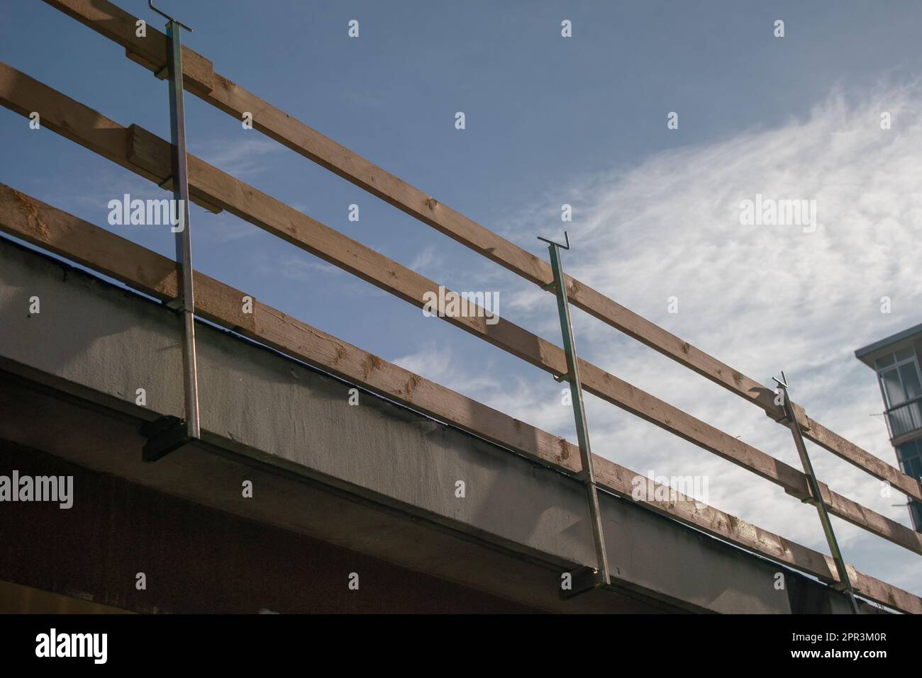 fall arrest scaffolding on a construction site. roof with wooden