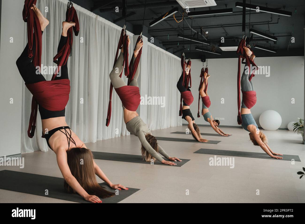 Woman suspended upside down in hi-res stock photography and images - Alamy