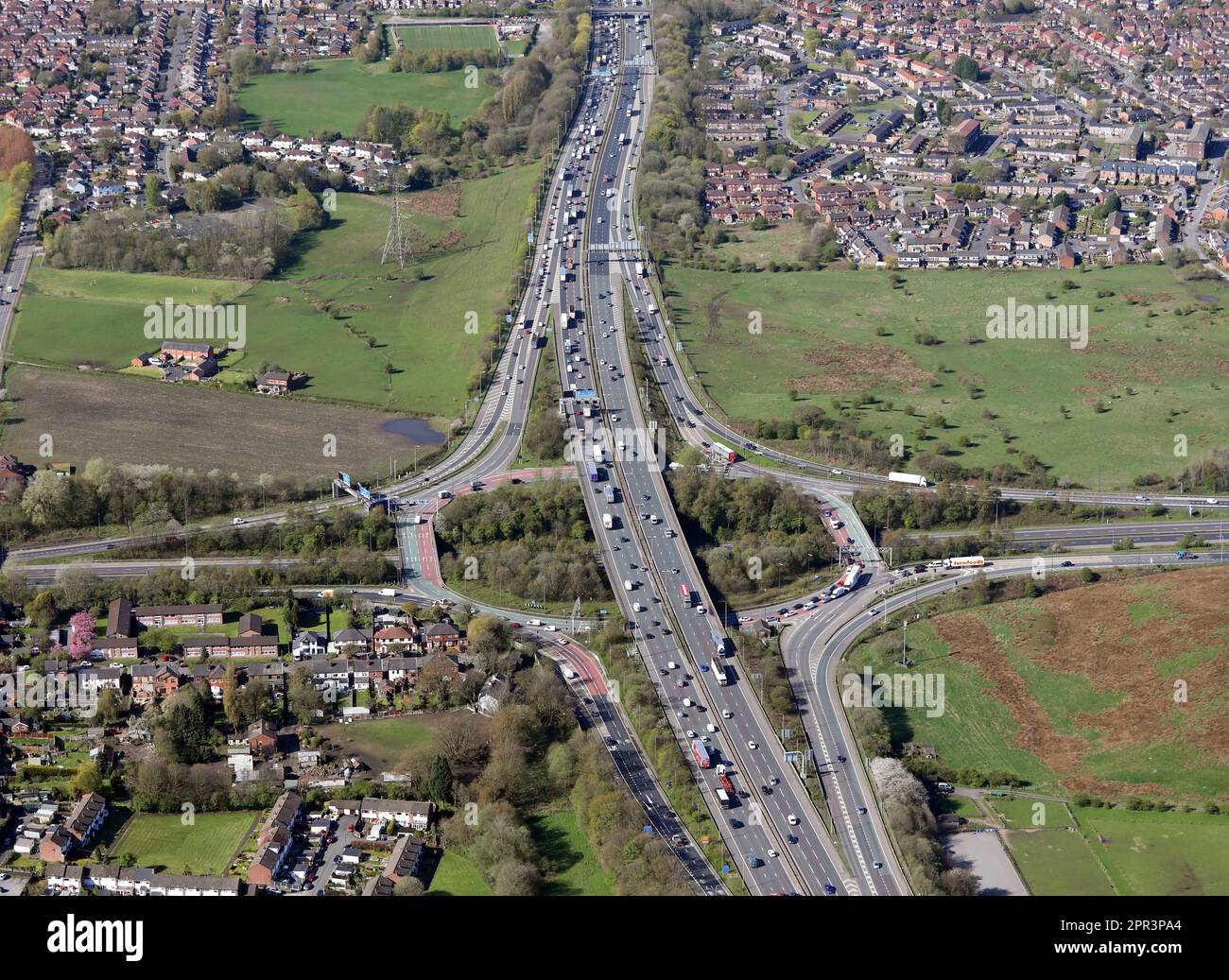 aerial view of Simister Island, junction 18 of M62 & junction 4 of M66 motorway at Whitefield, Manchester M25 2RS (this looking from East to West) Stock Photo