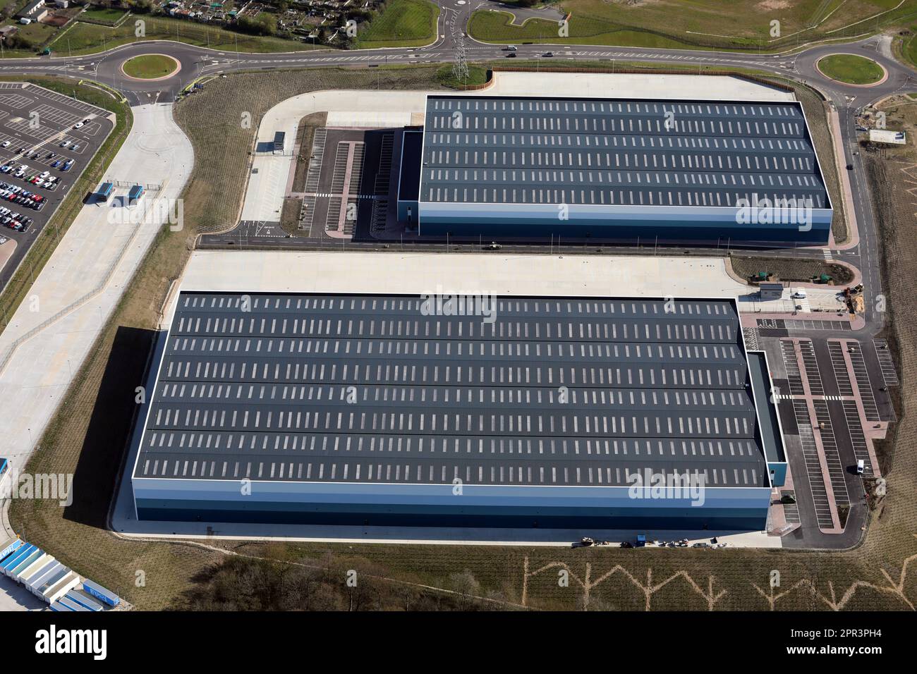 aerial view of two new distribution warehouses built on the A6135 east of junction 36 of the M1 Motorway Hoyland, Barnsley, South Yorkshire Stock Photo