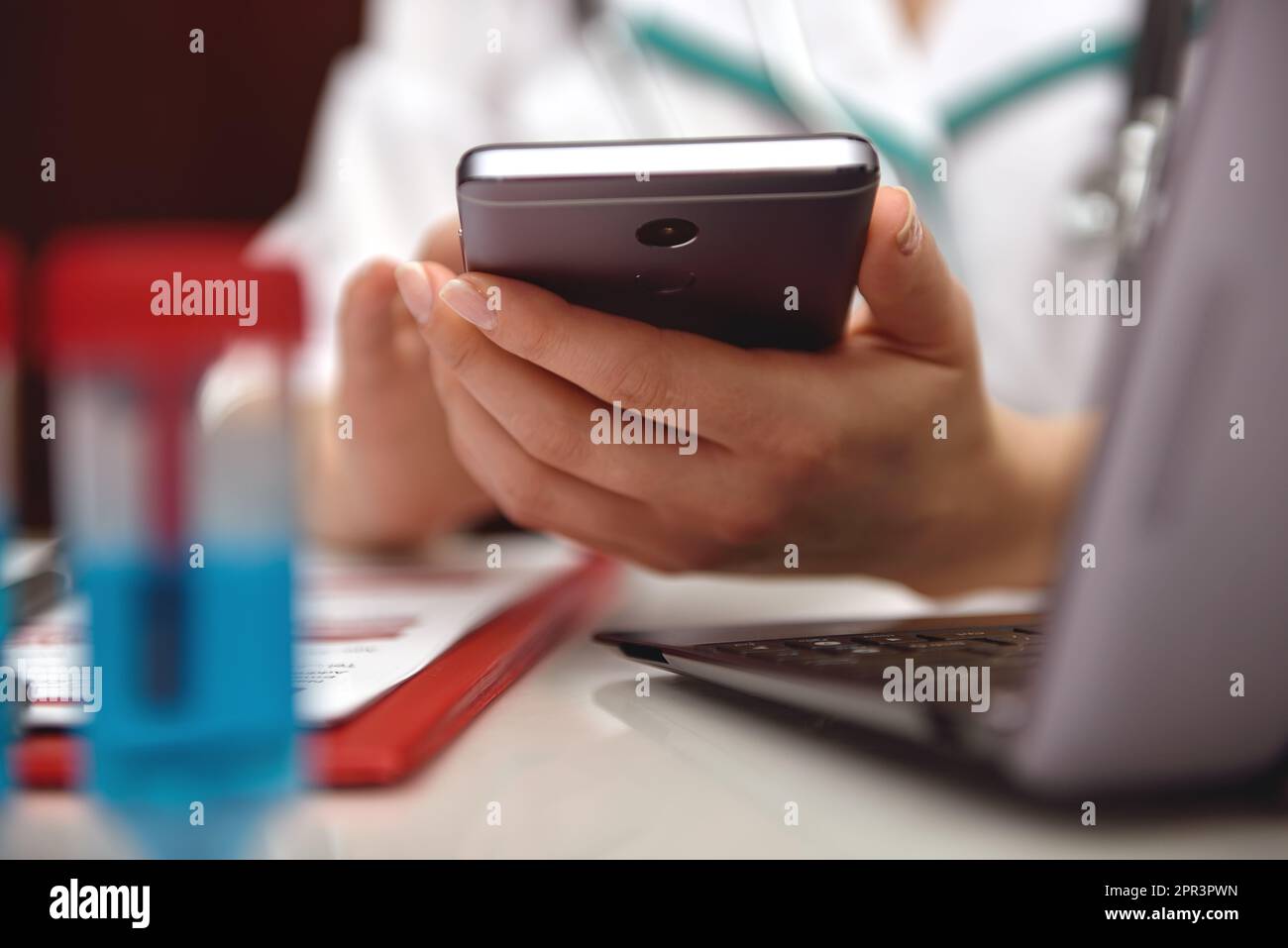 female medicine doctor holding mobile phone. close up Stock Photo