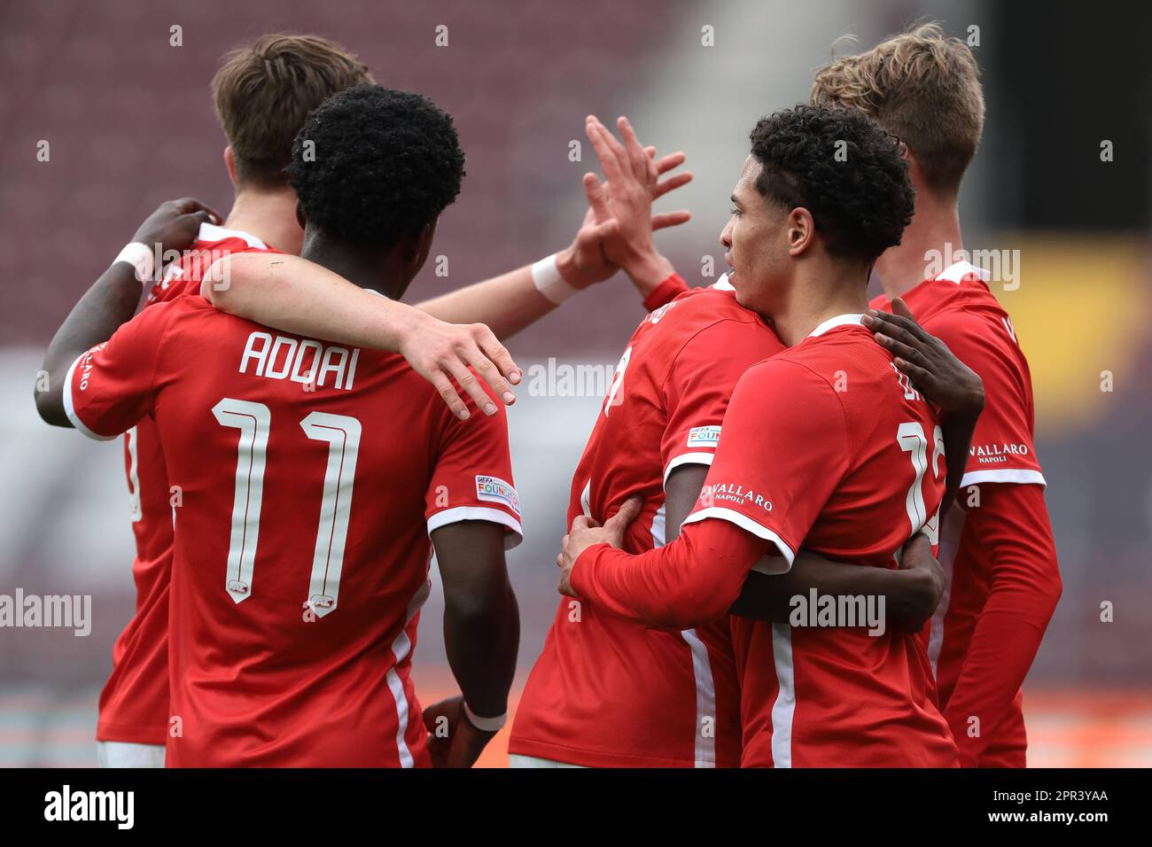 Geneva, Switzerland, 21st April 2023. Ro-Zangelo Daal of AZ Alkmaar  celebrates with team mates after scoring to give the side a 2-1 lead during  the UEFA Youth League match at Stade De