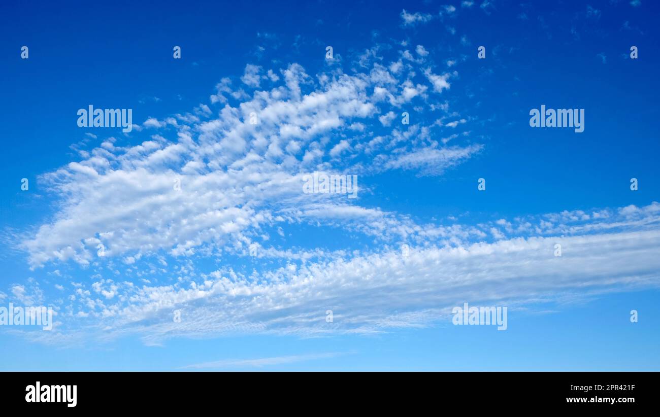 Cirrocumulus cloud high in a blue sky on a summer evening above Carmarthenshire Wales UK  KATHY DEWITT Stock Photo