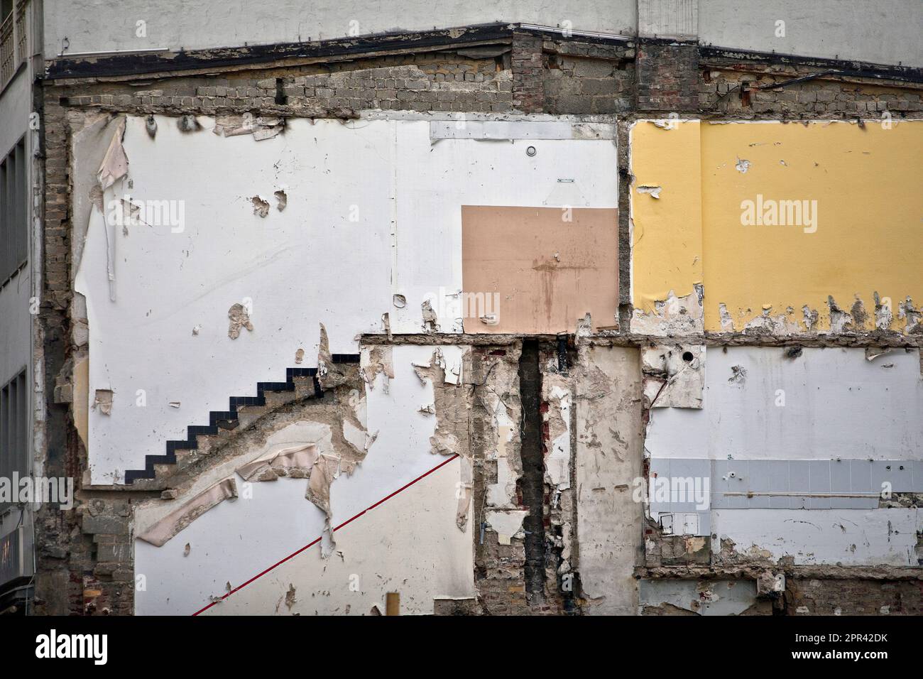 Exposed wall of a demolished residential building with traces of its former use, Germany, North Rhine-Westphalia, Cologne Stock Photo