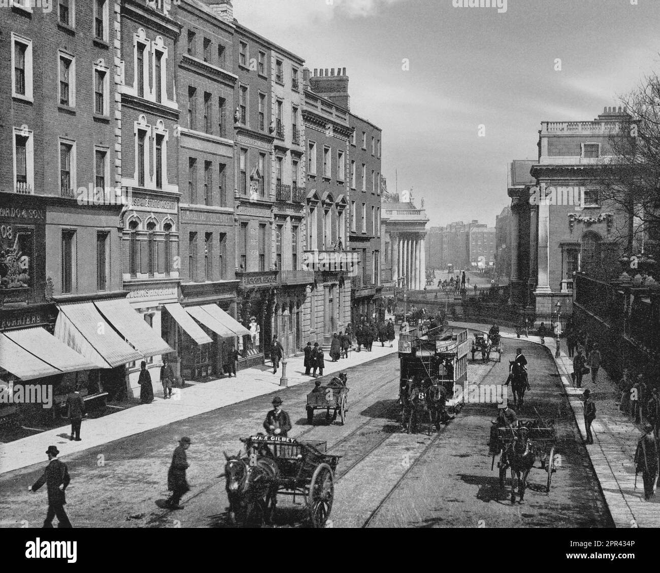 A late 19th century photograph of Grafton Street, Dublin city centre, Ireland at the College Green end,originally a fashionable residential street with some commercial activity. It became increasingly dilapidated  by 1849, then during the late 19th century, a number of retail properties were built and several long standing businesses established their presence on the street, such as the department stores Switzer's and Brown Thomas. The jewellers Weirs opened in 1869.  During the 20th century, it became known for the coffee house Bewley's, mid- and up-market shopping, and as a popular spot for Stock Photo