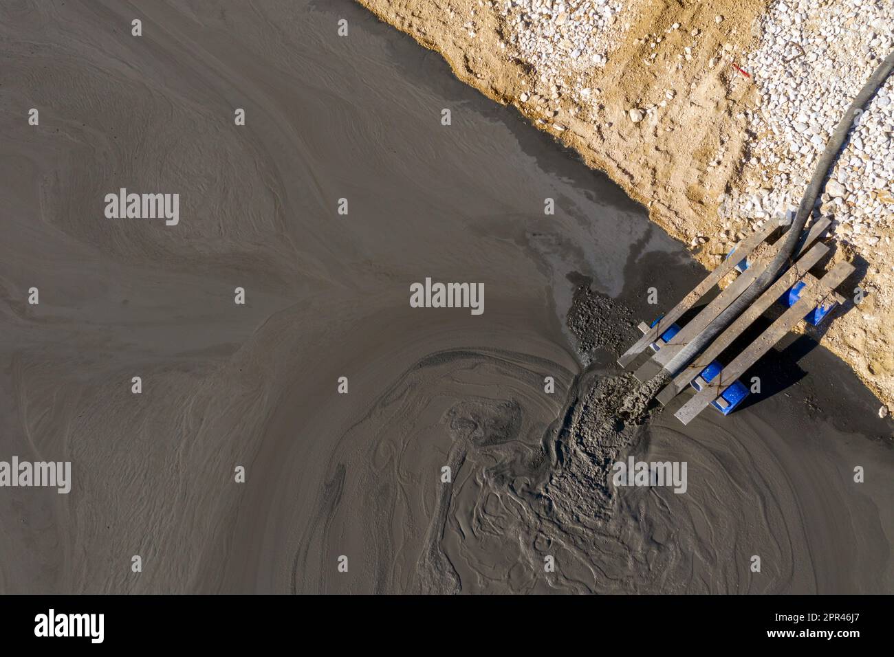 Aerial view of heavy metal contamination from a copper mine. Mining residual waters discharging into decanting pond. Geamana, Romania Stock Photo